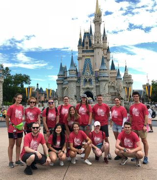 student group photo in front of cinderella castle